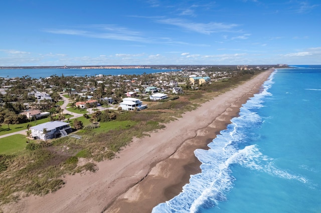 aerial view featuring a water view and a view of the beach