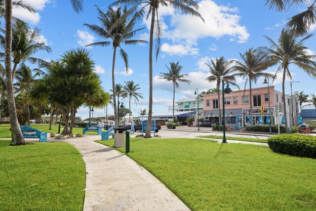 view of home's community with a yard