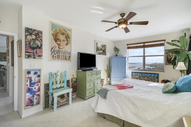 bedroom with light colored carpet and ceiling fan