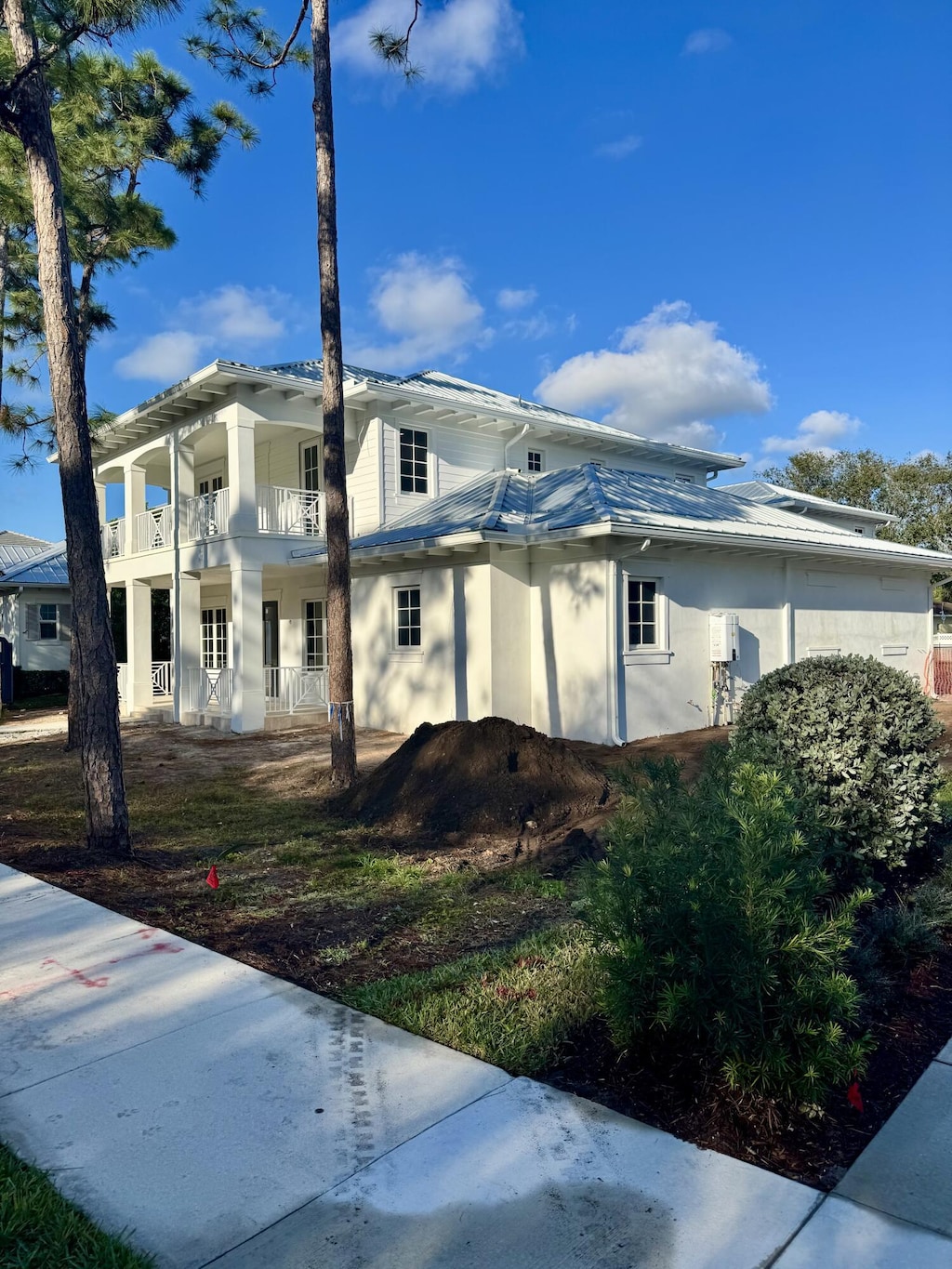 view of side of home featuring a balcony