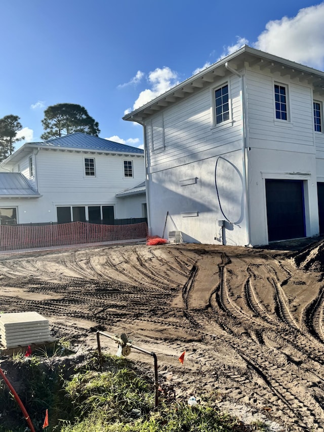 view of property exterior featuring a garage