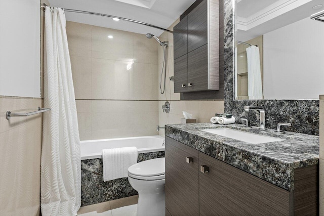 full bathroom with shower / tub combo with curtain, tile patterned floors, toilet, tasteful backsplash, and vanity