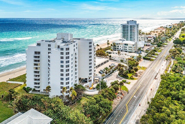 bird's eye view with a beach view and a water view