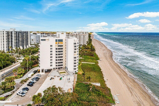 drone / aerial view with a view of the beach and a water view