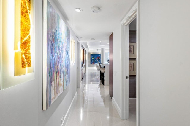 hallway with light tile patterned flooring