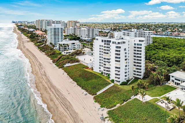 birds eye view of property with a view of the beach and a water view