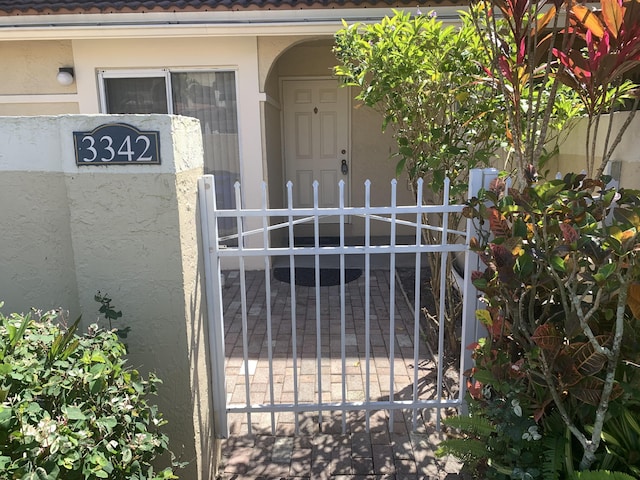 view of gate with fence