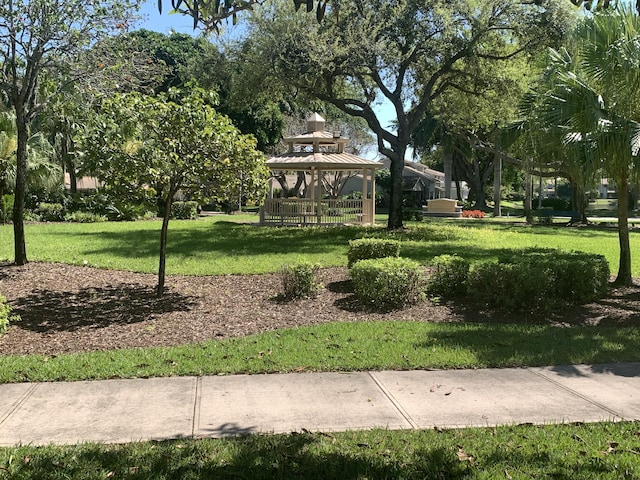 view of home's community with a gazebo and a lawn