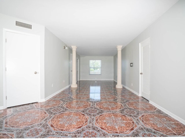 empty room with ornate columns