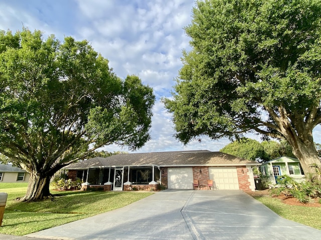2086 SE Bisbee St, Port Saint Lucie, FL 34952 - ranch-style home with a garage, a front yard, driveway, and brick siding
