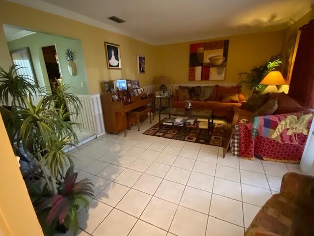 living room with light tile patterned floors