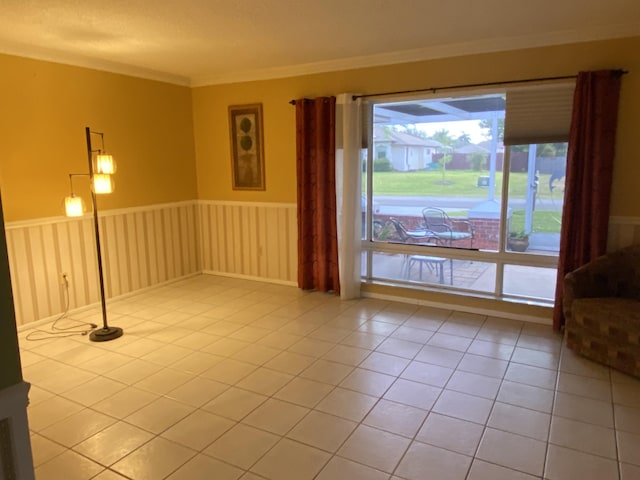 2086 SE Bisbee St, Port Saint Lucie, FL 34952 - empty room featuring crown molding and tile patterned floors