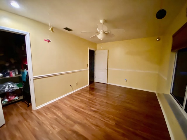 2086 SE Bisbee St, Port Saint Lucie, FL 34952 - interior space with a ceiling fan, baseboards, visible vents, and wood finished floors