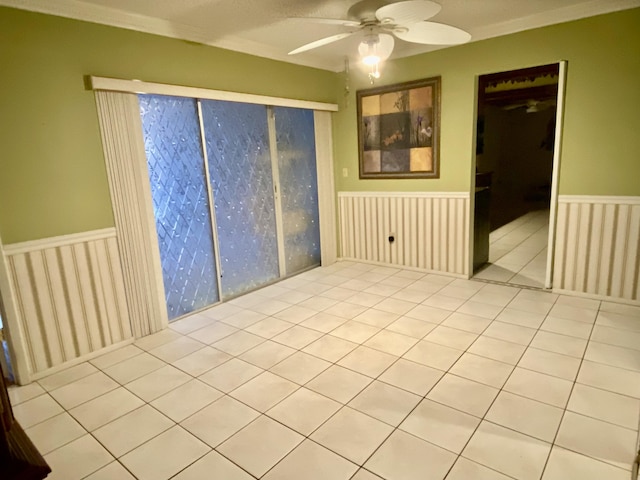 2086 SE Bisbee St, Port Saint Lucie, FL 34952 - unfurnished room with a ceiling fan and wainscoting