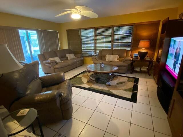 living room with light tile patterned flooring and ceiling fan