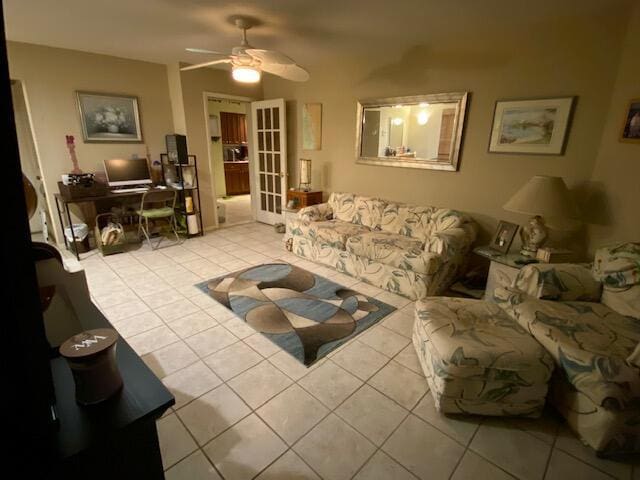 living room featuring light tile patterned floors, french doors, and ceiling fan