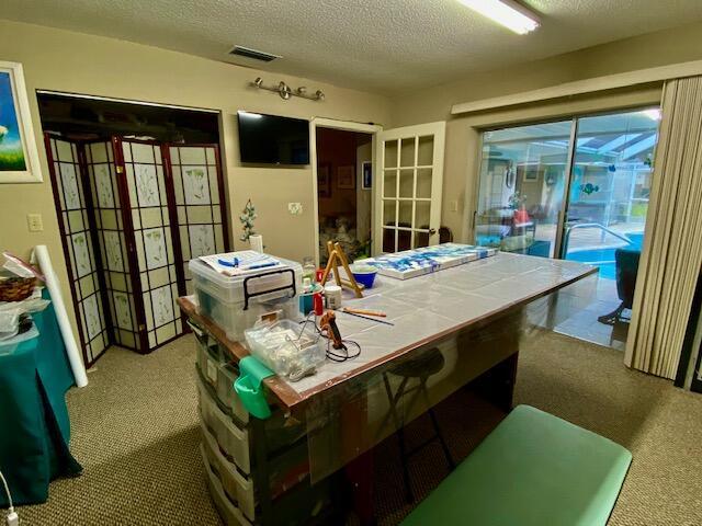 2086 SE Bisbee St, Port Saint Lucie, FL 34952 - interior space featuring a textured ceiling and visible vents