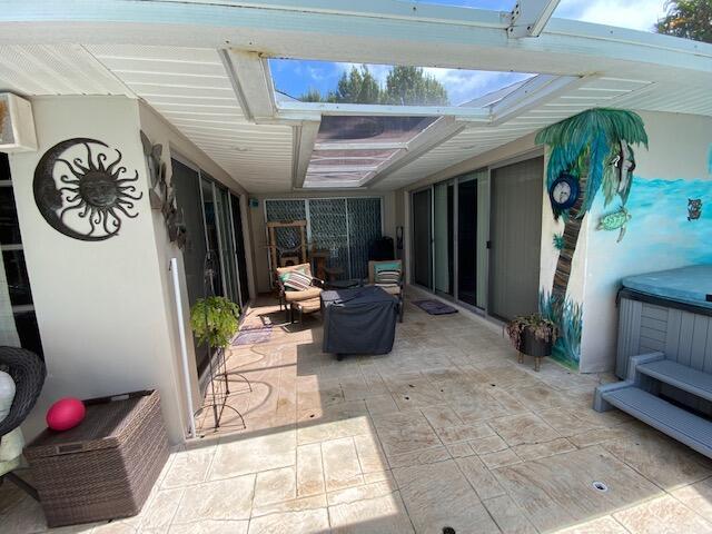 view of patio / terrace with glass enclosure