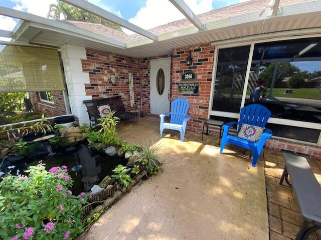 view of patio / terrace with a lanai