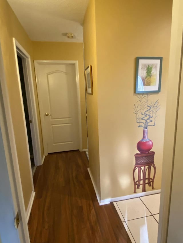 2086 SE Bisbee St, Port Saint Lucie, FL 34952 - hallway with baseboards and dark wood-type flooring