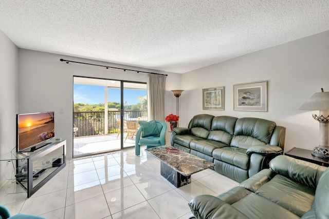 living room featuring light tile patterned floors and a textured ceiling