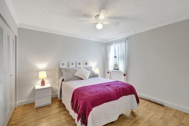 bedroom with ornamental molding and light hardwood / wood-style floors