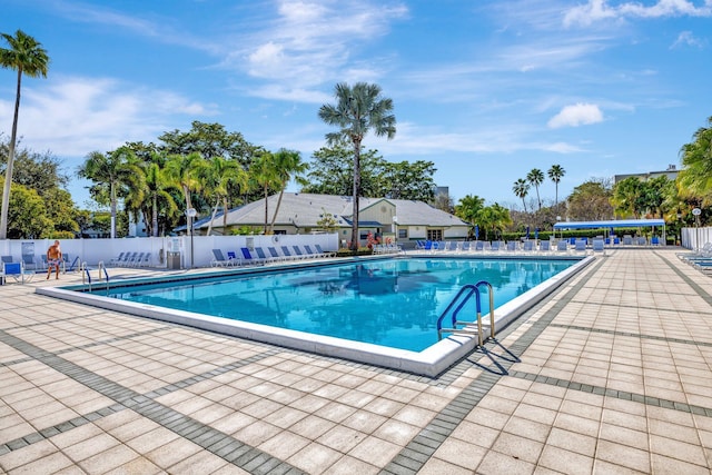 view of swimming pool featuring a patio area