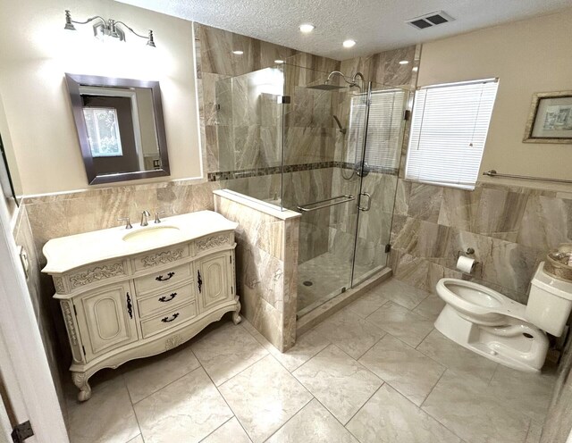 bathroom with tile walls and toilet