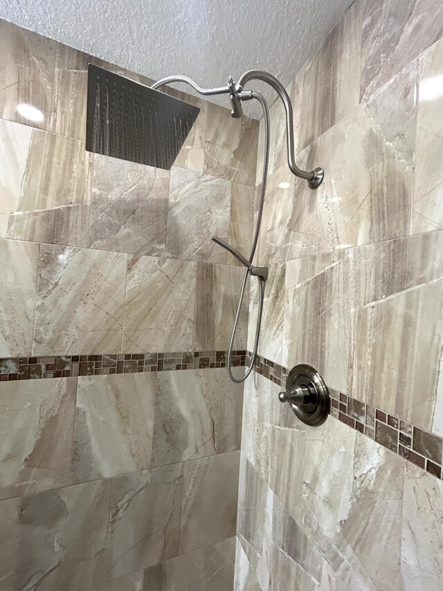 bathroom featuring vanity and tile walls