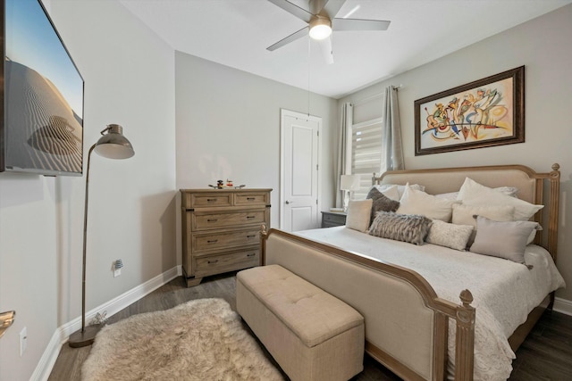 bedroom featuring ceiling fan and dark hardwood / wood-style floors