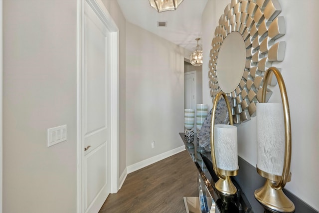 hallway with dark hardwood / wood-style floors