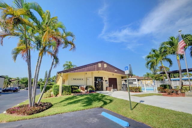 view of building exterior with fence