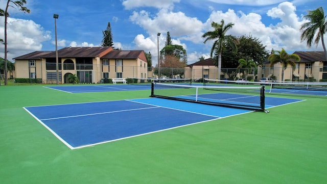 view of sport court featuring community basketball court and fence