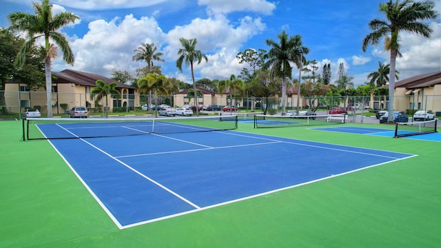 view of sport court with fence