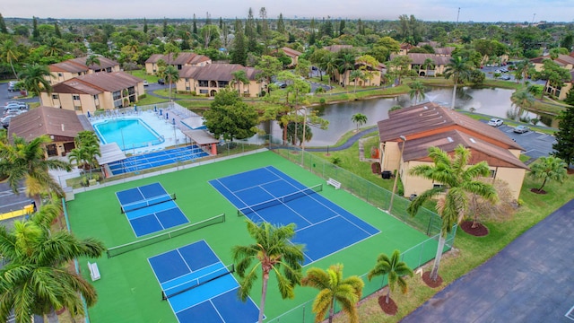 birds eye view of property featuring a residential view and a water view