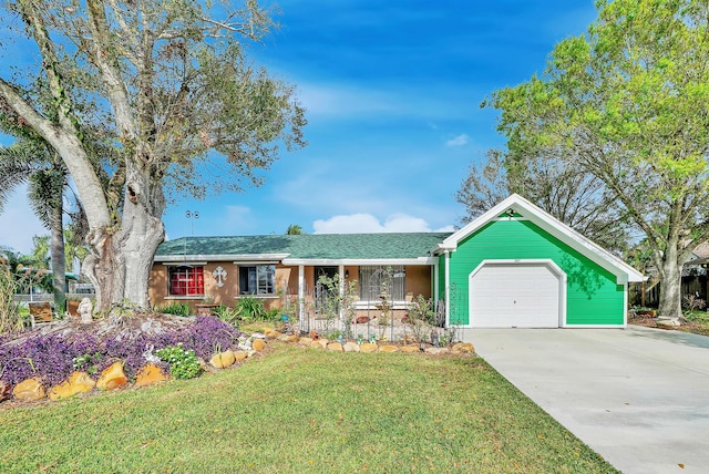 ranch-style house with a porch, a garage, and a front yard