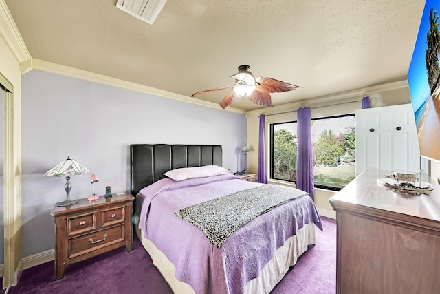 carpeted bedroom featuring crown molding, ceiling fan, and a textured ceiling