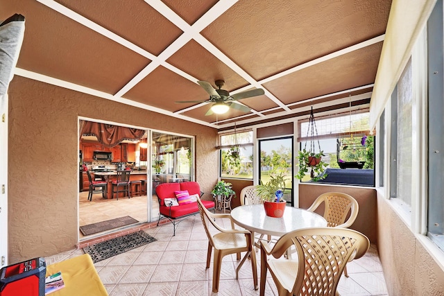 sunroom featuring coffered ceiling and ceiling fan