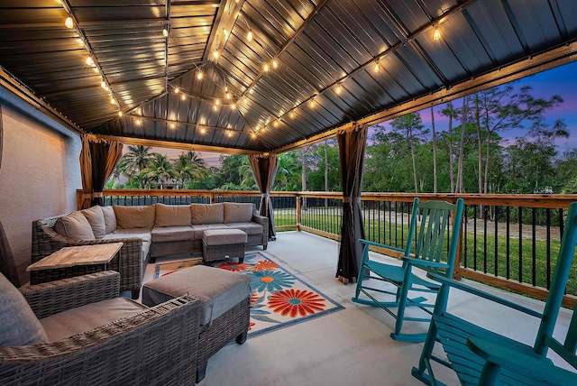 patio terrace at dusk with outdoor lounge area