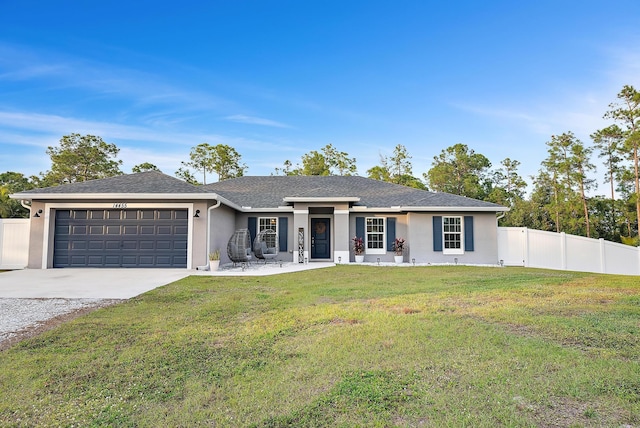 ranch-style home with a garage and a front lawn