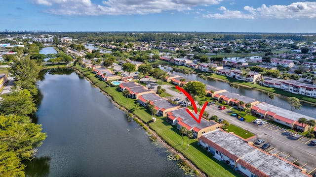 aerial view with a residential view and a water view