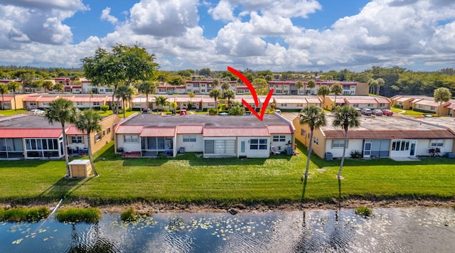 birds eye view of property featuring a residential view and a water view