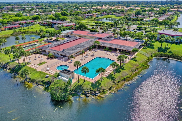 birds eye view of property with a water view