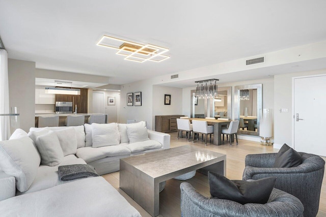 living room with light hardwood / wood-style flooring