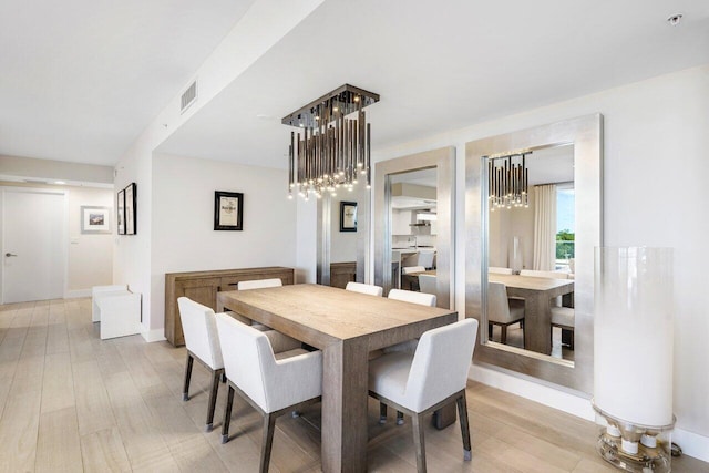 dining room featuring light hardwood / wood-style flooring