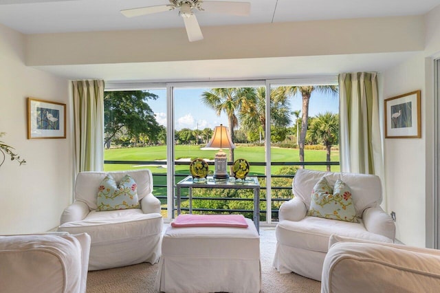 sunroom with ceiling fan and a healthy amount of sunlight