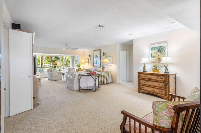 interior space with ceiling fan and a textured ceiling