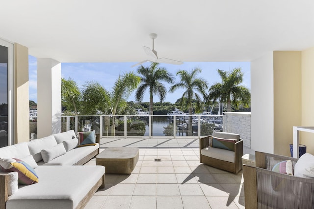 view of patio / terrace with an outdoor hangout area, ceiling fan, and a water view