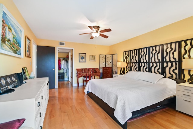 bedroom featuring ceiling fan and light wood-type flooring