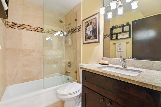 full bathroom featuring vanity, toilet, and tiled shower / bath combo